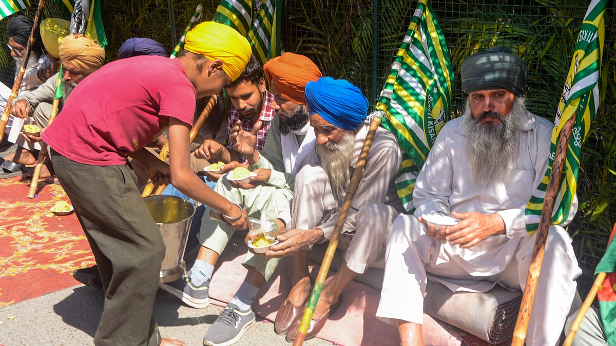 Farmers of the KMM and SKM (Apolitical) sit outside the home of Punjab minister Kuldeep Singh Dhaliwal