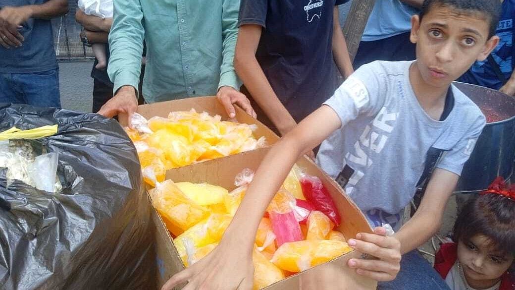 A Gaza community kitchen run by an international agency. Children are often the family's food couriers