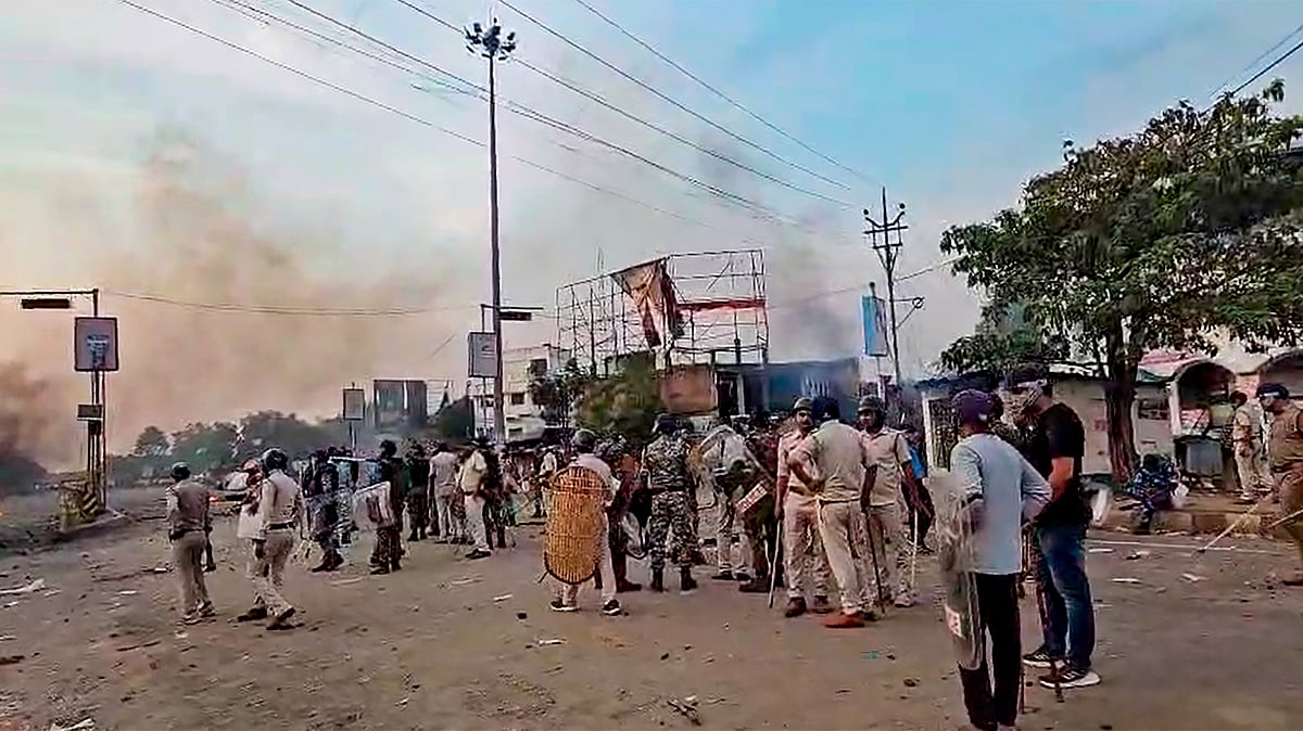Security personnel stand guard during a protest in Murshidabad on 11 April (photo: PTI)