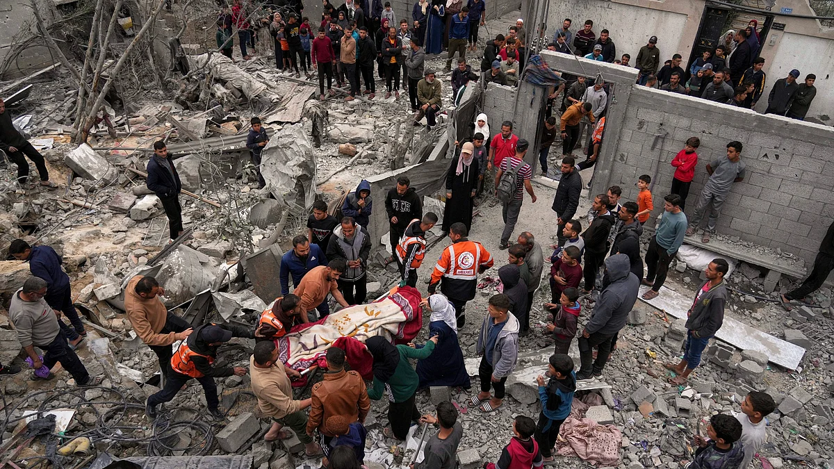 A body being removed from the rubble in Gaza City on 13 April (photo: AP/PTI)