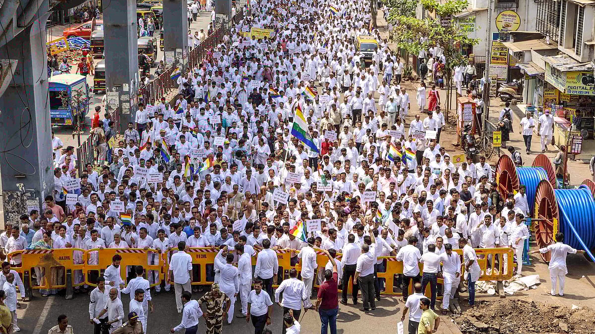 People protest against demolition of a Jain temple at Vile Parle area, in Mumbai on 19 April (photo: PTI)