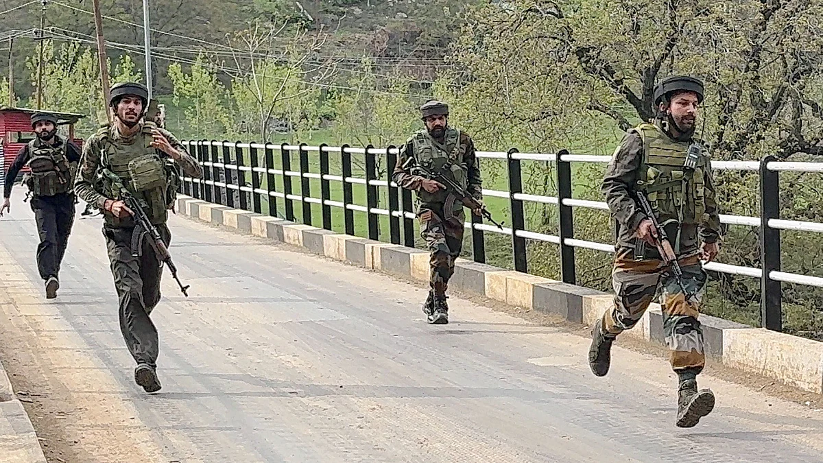 Security forces rush to the site of the alleged terror attack in Pahalgam (photo: PTI)