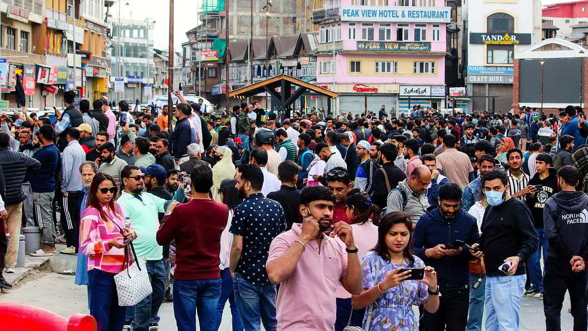 Tourists and locals at a protest against the Pahalgam attack, in Srinagar (photo: PTI) 