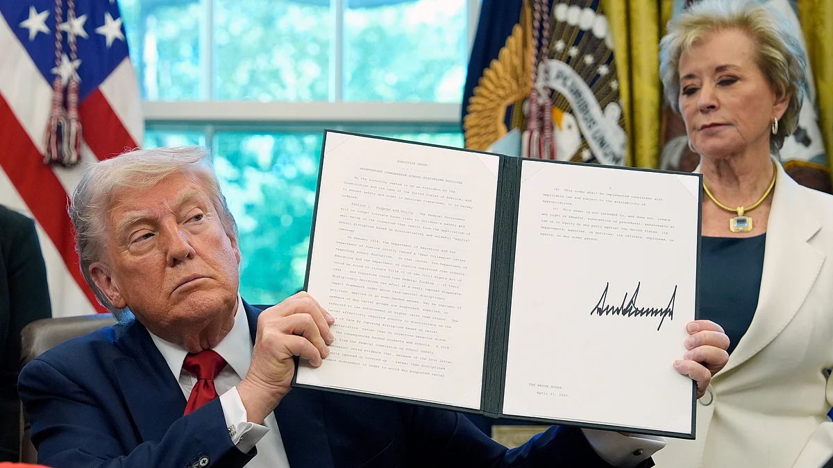 Donald Trump holds an executive order at White House on 23 April (photo: AP/PTI)