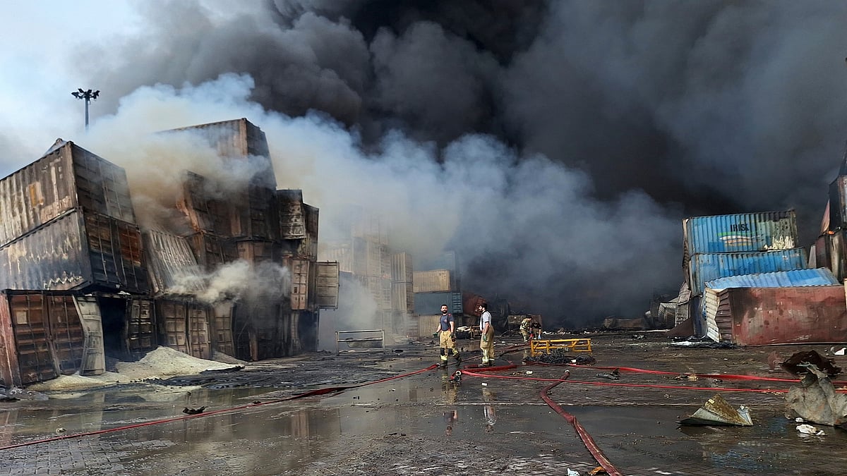 Firefighters busy extinguishing the fire at a port near Bandar Abbas on 27 April (photo: AP/PTI)