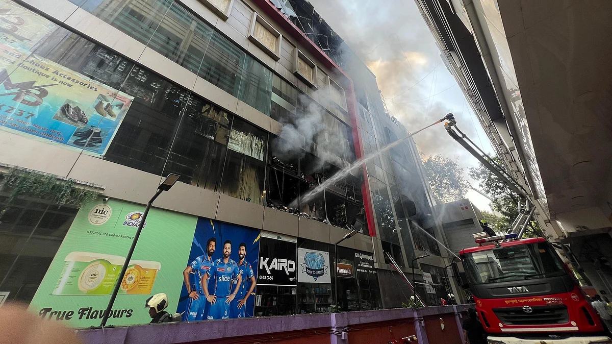 Firefighters busy dousing the flame in Mumbai on 29 April (photo: PTI)