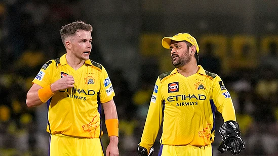 An exasperated M.S. Dhoni with Sam Curran on 30 April