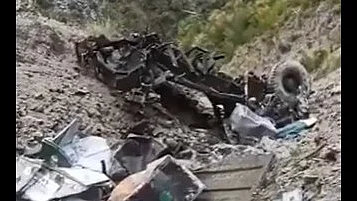 The truck was reduced to a mangled heap after the fall