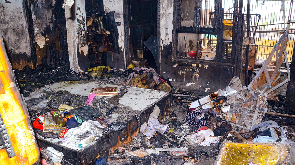 Charred remains of goods after fire breaks out in five-storey building in Kanpur on 4 May (photo: PTI)