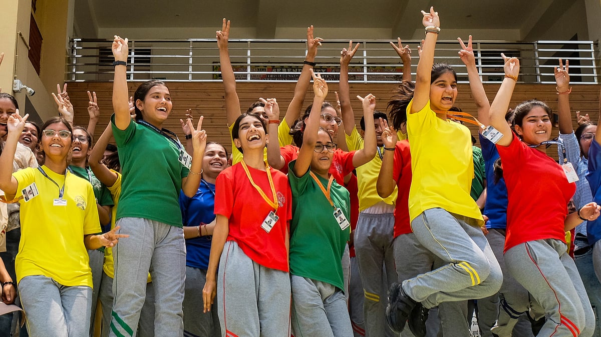 Girls celebrate after the announcement of Board's exam results (photo: PTI)