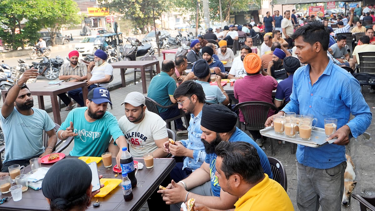 Amritsar assembles in the streets for its early morning chai after a blackout night
