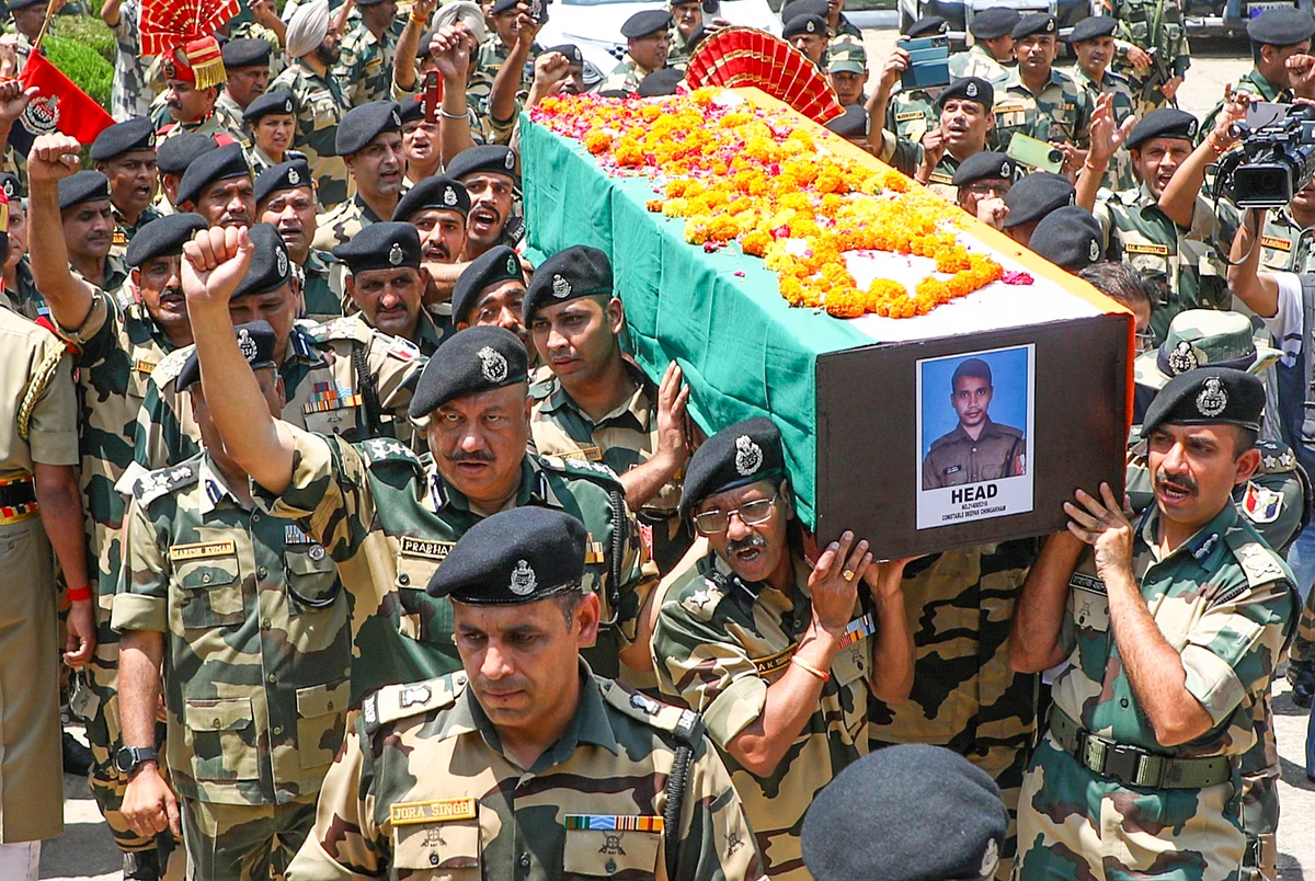 BSF personnel lay to rest BSF constable Deepak Chingakham, who was martyred in the line of duty in Jammu