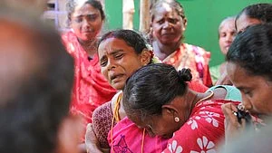 Family members mourn in Amritsar district on 13 May (photo: IANS)