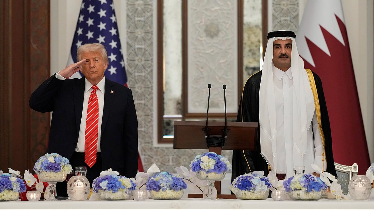 Donald Trump with Qatar's Emir Sheikh Tamim bin Hamad Al Thani in Doha on 14 May (photo: AP/PTI)