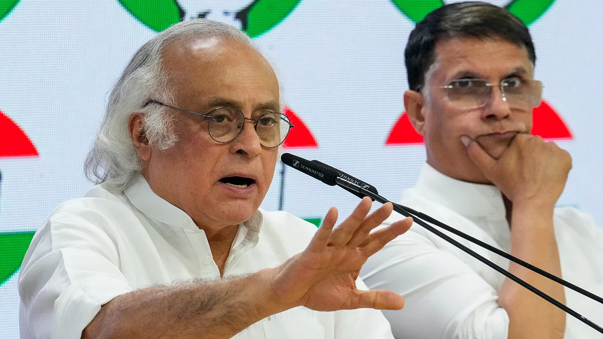 Jairam Ramesh and Pawan Khera at a press conference in New Delhi on 14 May (photo: PTI)