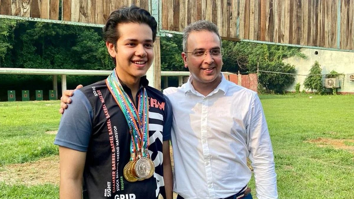 His father's son: Adriyan with Olympian and World Cupper Joydeep Karmakar