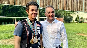 His father's son: Adriyan with Olympian and World Cupper Joydeep Karmakar