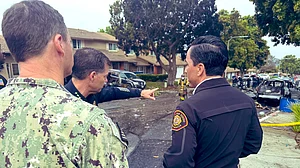 San Diego mayor Todd Gloria takes stock, in a debriefing with emergency responders at the crash site