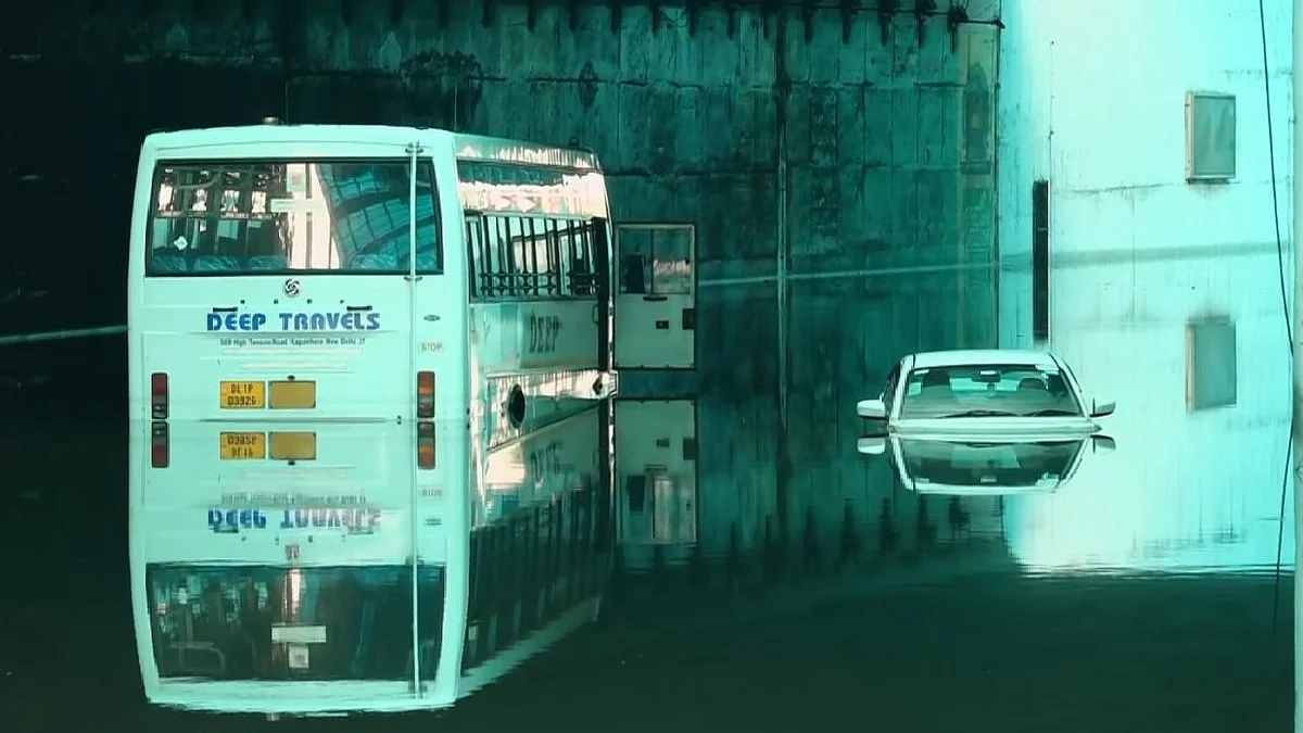 Vehicles submerged in an underpass waterlogged by the thunderstorms in Delhi NCR