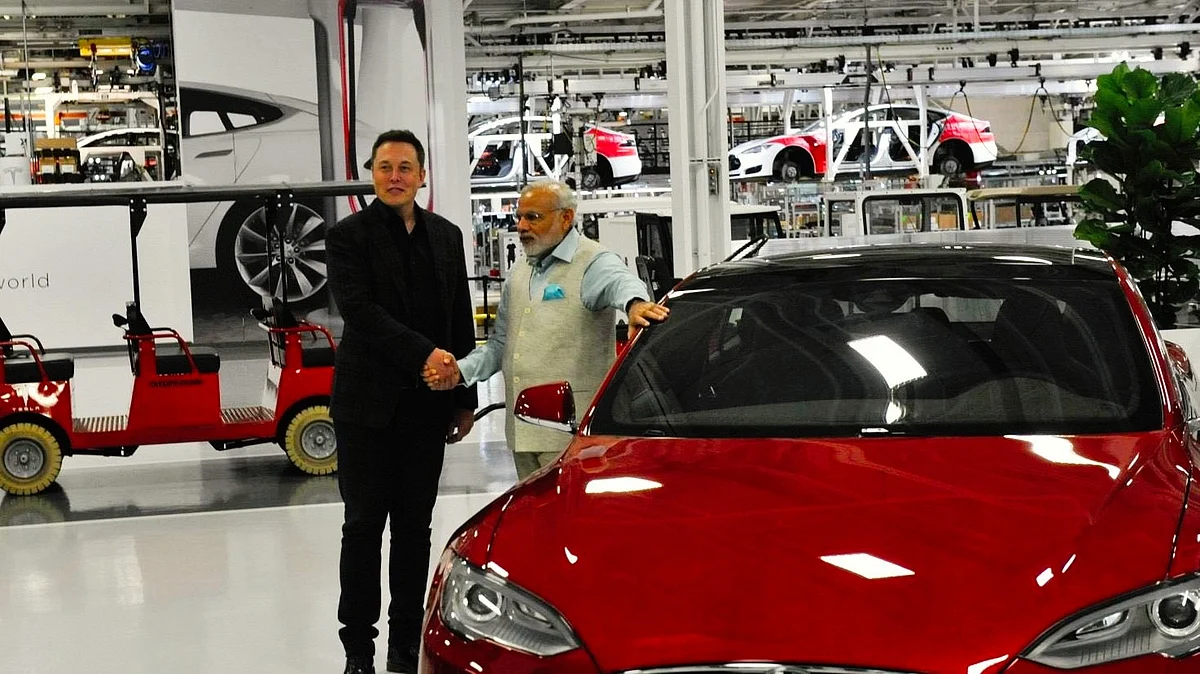 PM Modi and Elon Musk with a Tesla EV