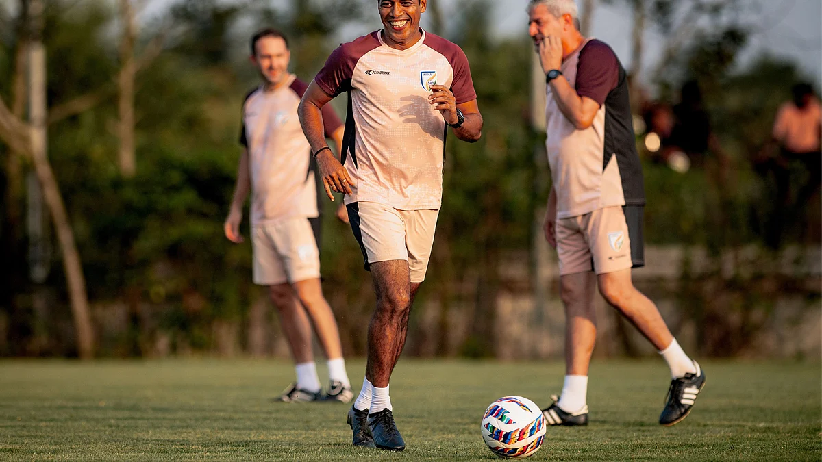 Mahesh Gawli, assistant coach, with Marquez during a training session