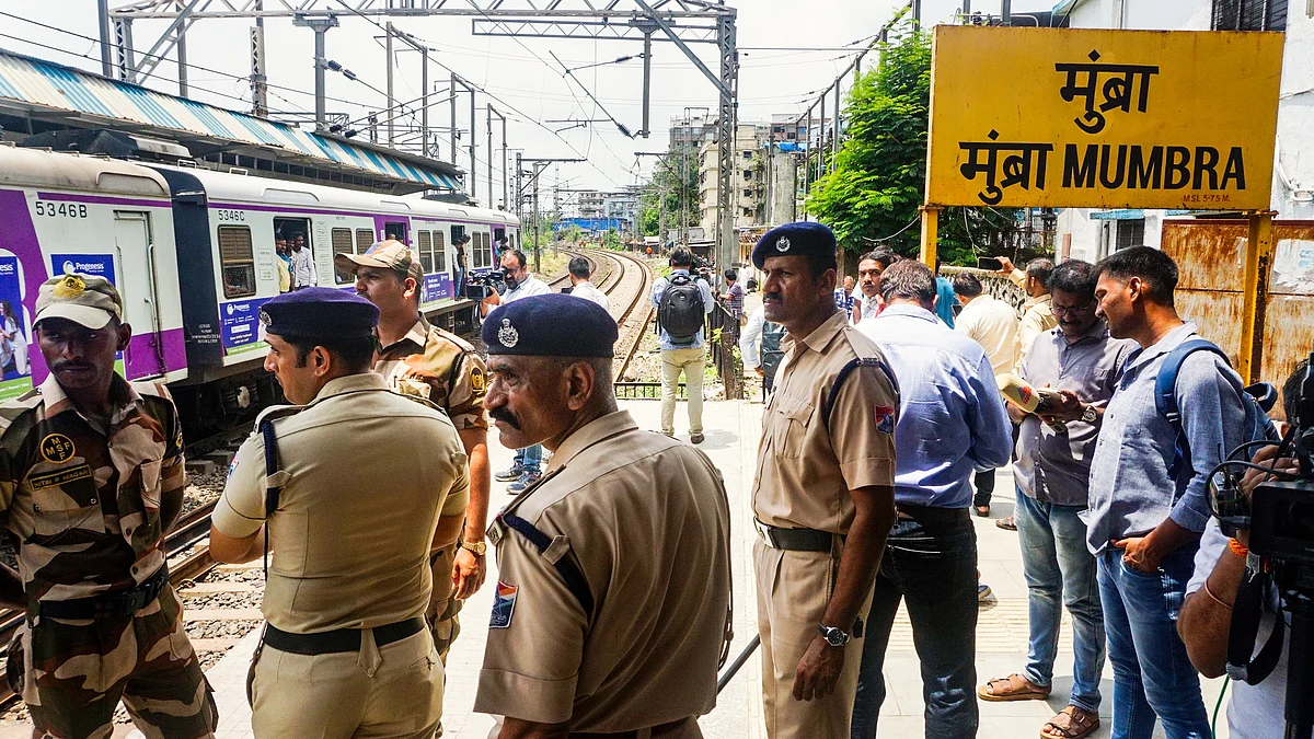 Police personnel at Mumbra railway station after the incident (photo: PTI)