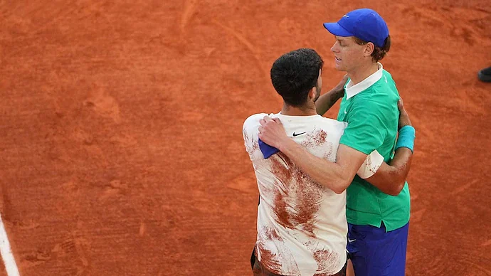 Carlos Alcaraz consoles Jannik Sinner after the final