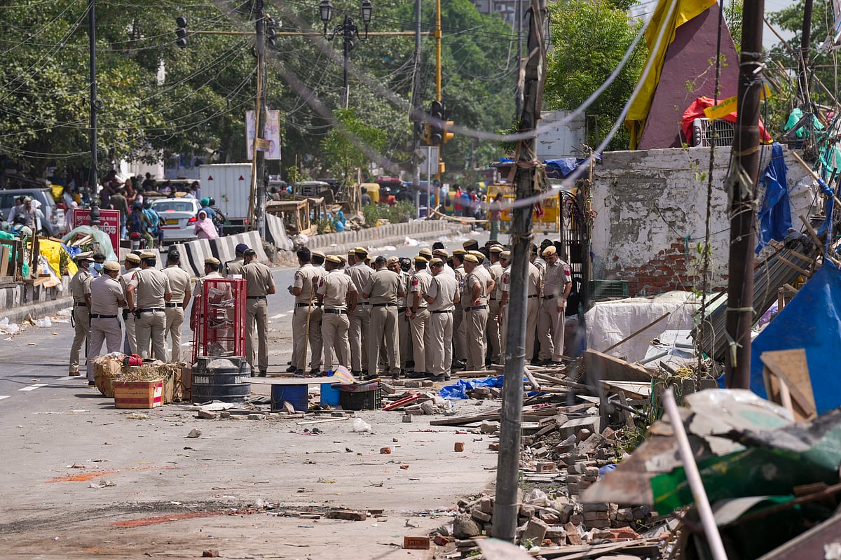 Heavy police presence at Bhoomiheen camp in Delhi during its demolition in the face of residents' protests