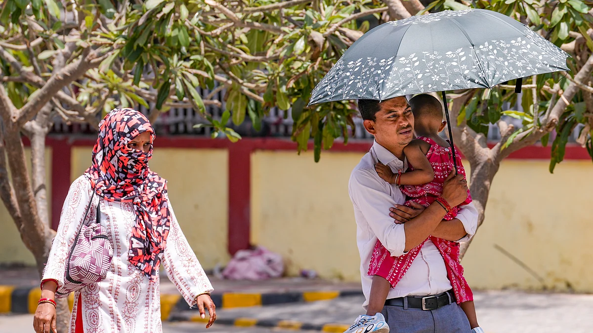 Delhi residents cover up against the scorcher of the hottest day of the year, past 45 degrees Celsius