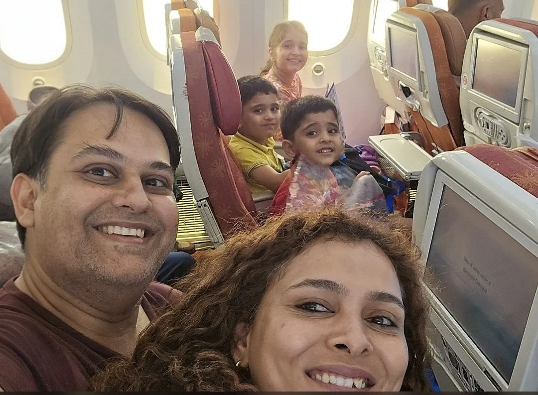 Dr Komi Vyas, husband Pratik Joshi and their three children across the aisle