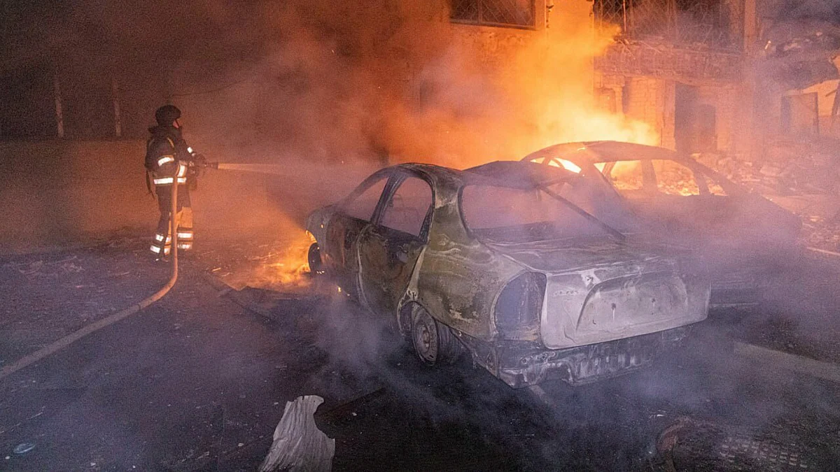 A rescue worker busy dousing the fire in Kharkiv on 12 June (photo: AP/PTI)