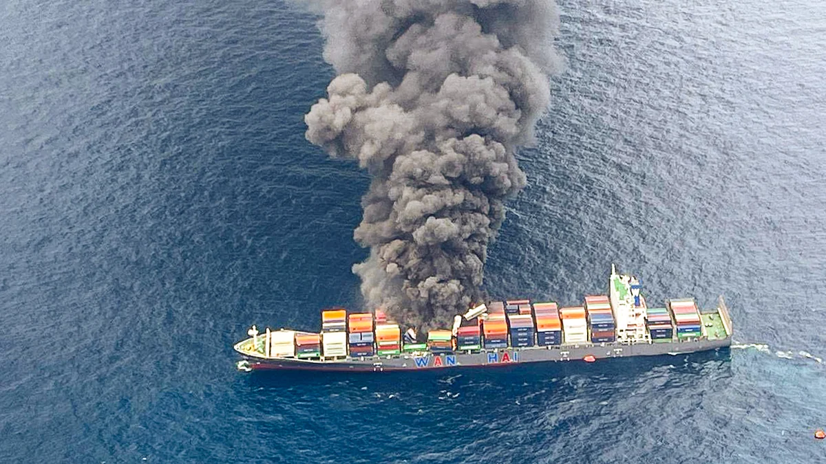 Smoke billows from Singapore-flagged container vessel off Kerala coast (photo: @IndiaCoastGuard/X) 