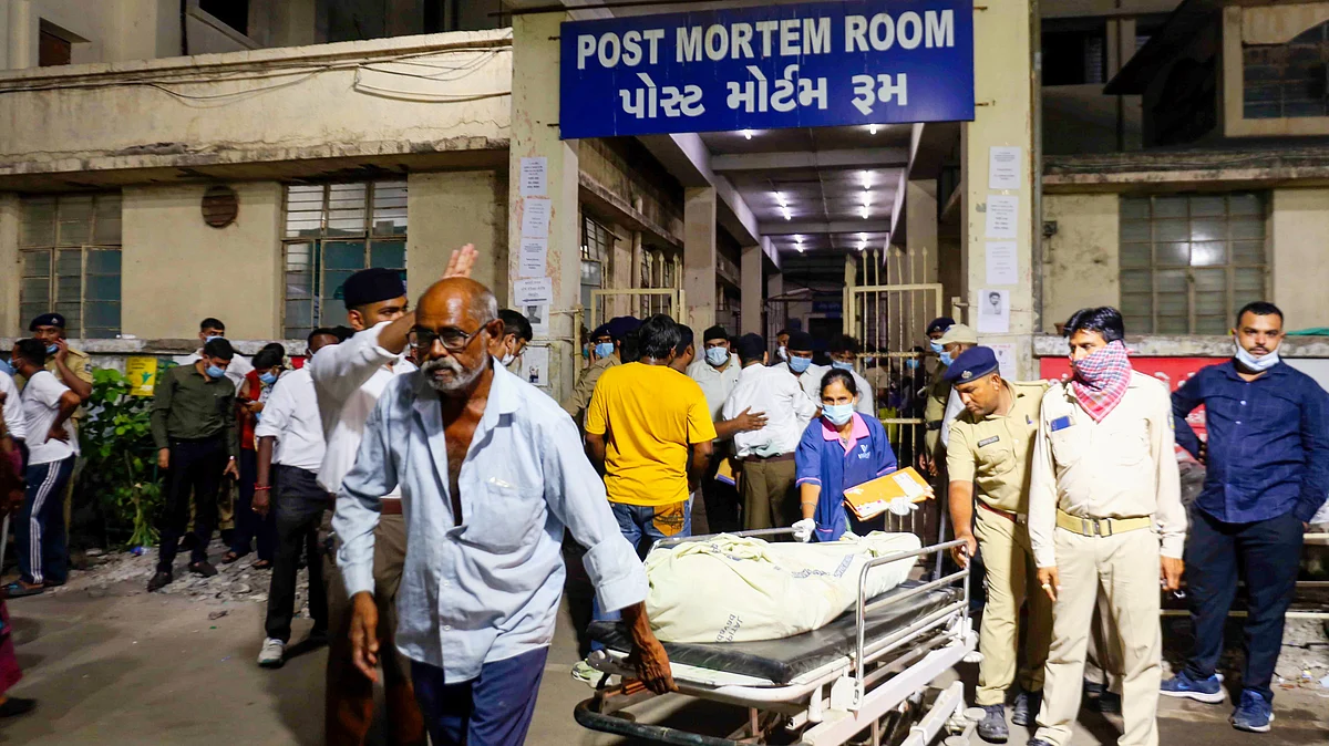 Remains being carried out of the hospital in Ahmedabad (photo: PTI)
