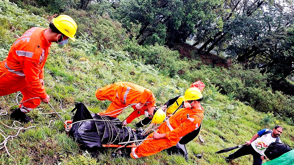 NDRF personnel at the spot after the crash on 15 June (photo: PTI)