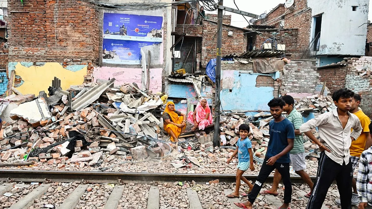 Residents amidst the rubble at Ashok Vihar (photo: Vipin/NH)