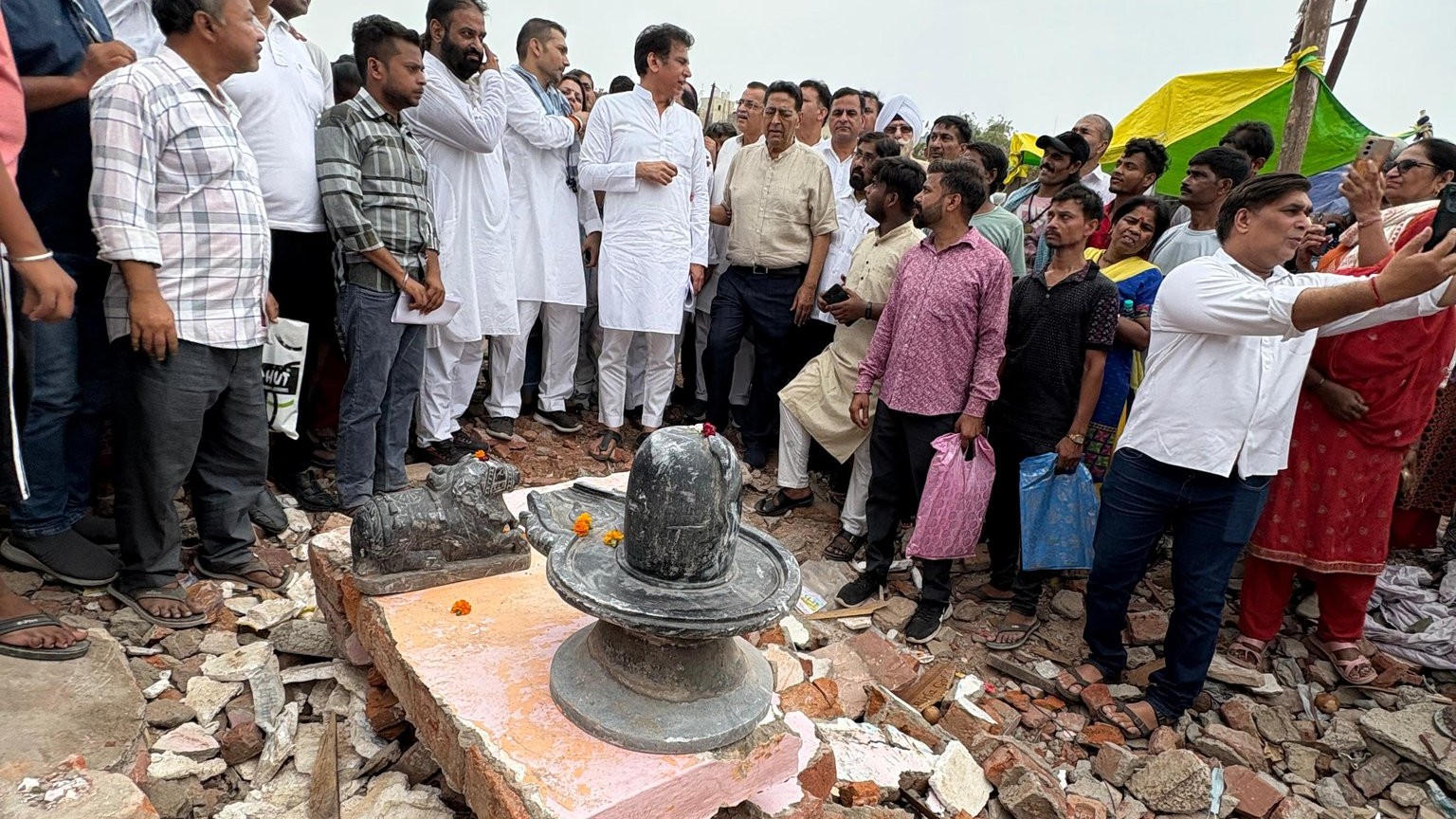 Devendra Yadav at the demolition site (photo: @devendrayadvinc/X)