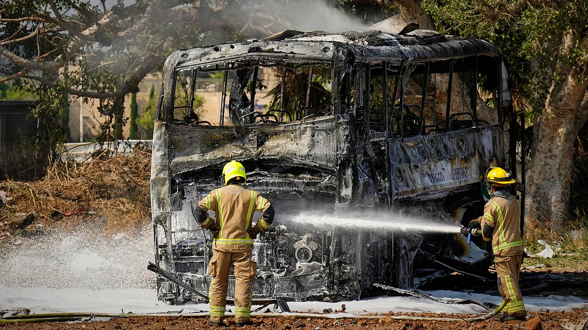 Firefighters work at site hit by an Iranian missile in central Israel on 17 June (photo: AP/PTI)