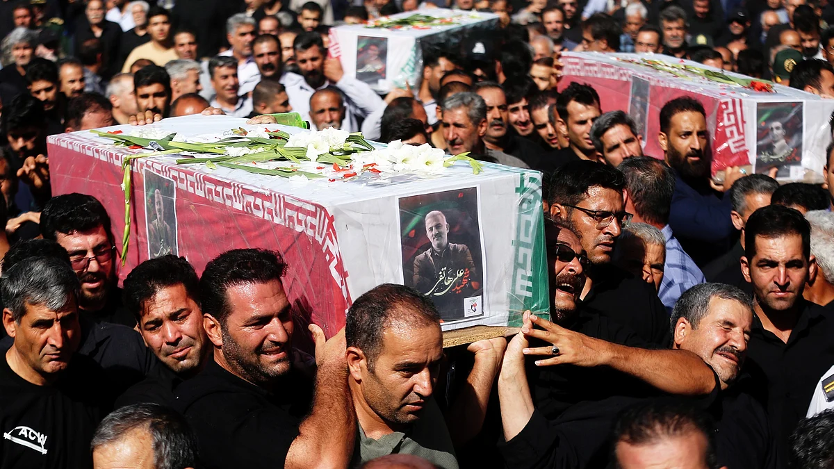 Mourners carry coffins of three Iranians reportedly killed in Israeli strikes in Asadabad (photo: AP/PTI)