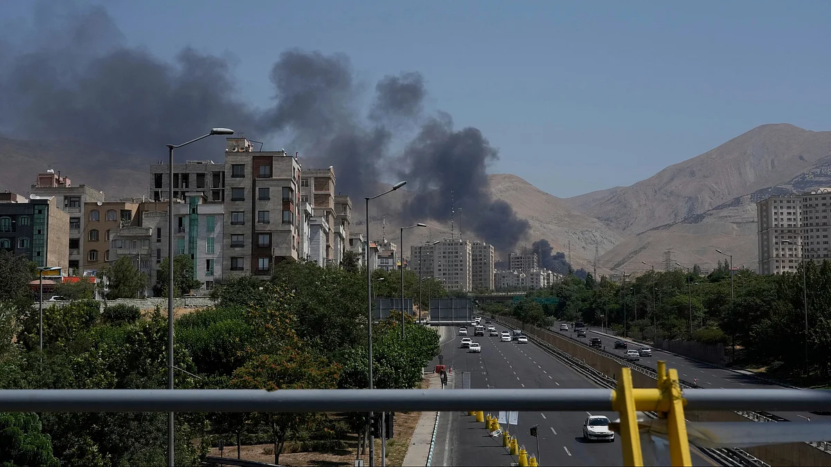 Smoke rises from an oil storage facility in Tehran on 16 June (photo: AP/PTI)