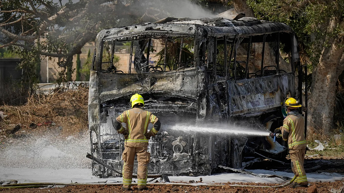 Firefighters work at site hit by Iranian missile in central Israel on 17 June (photo: AP/PTI)