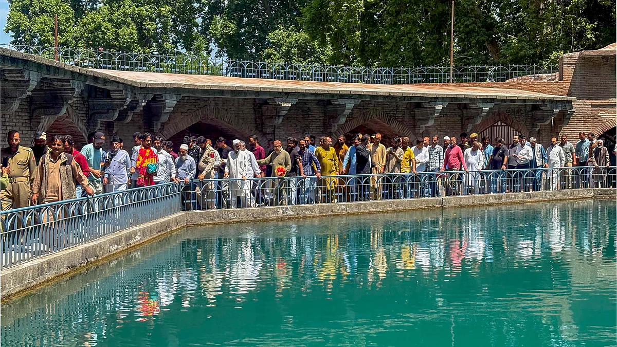 Visitors at Verinag Mughal Garden after it was reopened on Tuesday. (Photo: PTI)