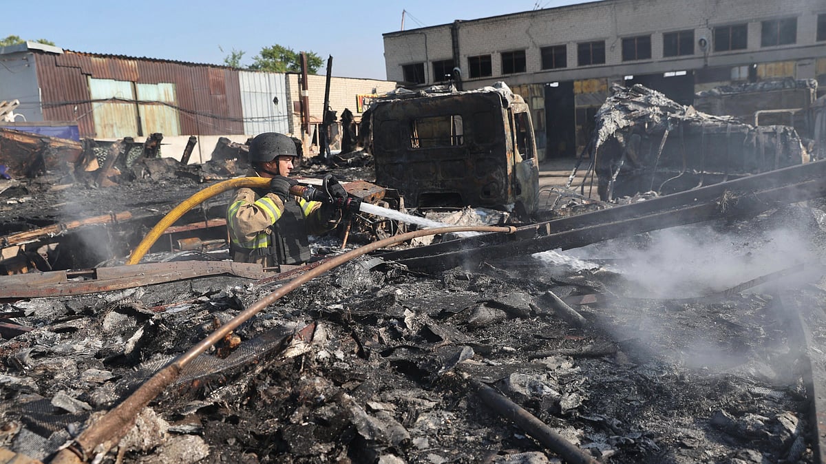 A rescue worker puts out fire at a destroyed site in Zaporizhzhia on 18 June (photo: AP/PTI)