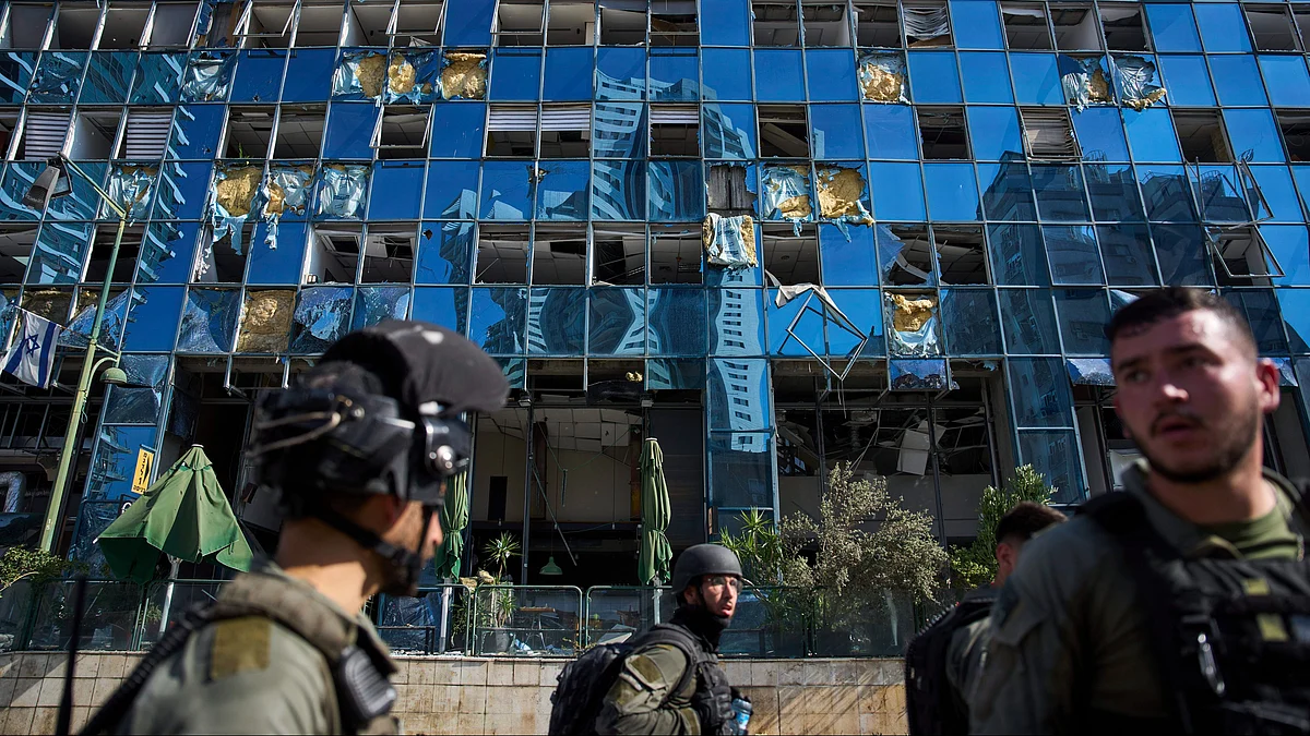 Rescue workers inspect a site in Ramat Gan, Israel on 19 June (photo: AP/PTI)