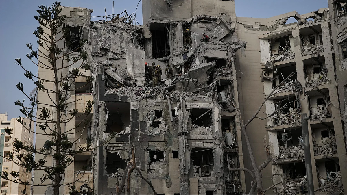 Israeli soldiers search for survivors in Beersheba, Israel on 24 June (photo: AP/PTI)