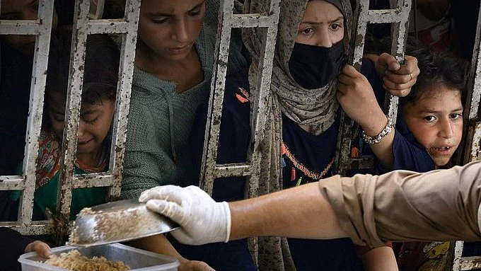 Food being distributed to Palestinians (photo: @UNHumanRights/X)