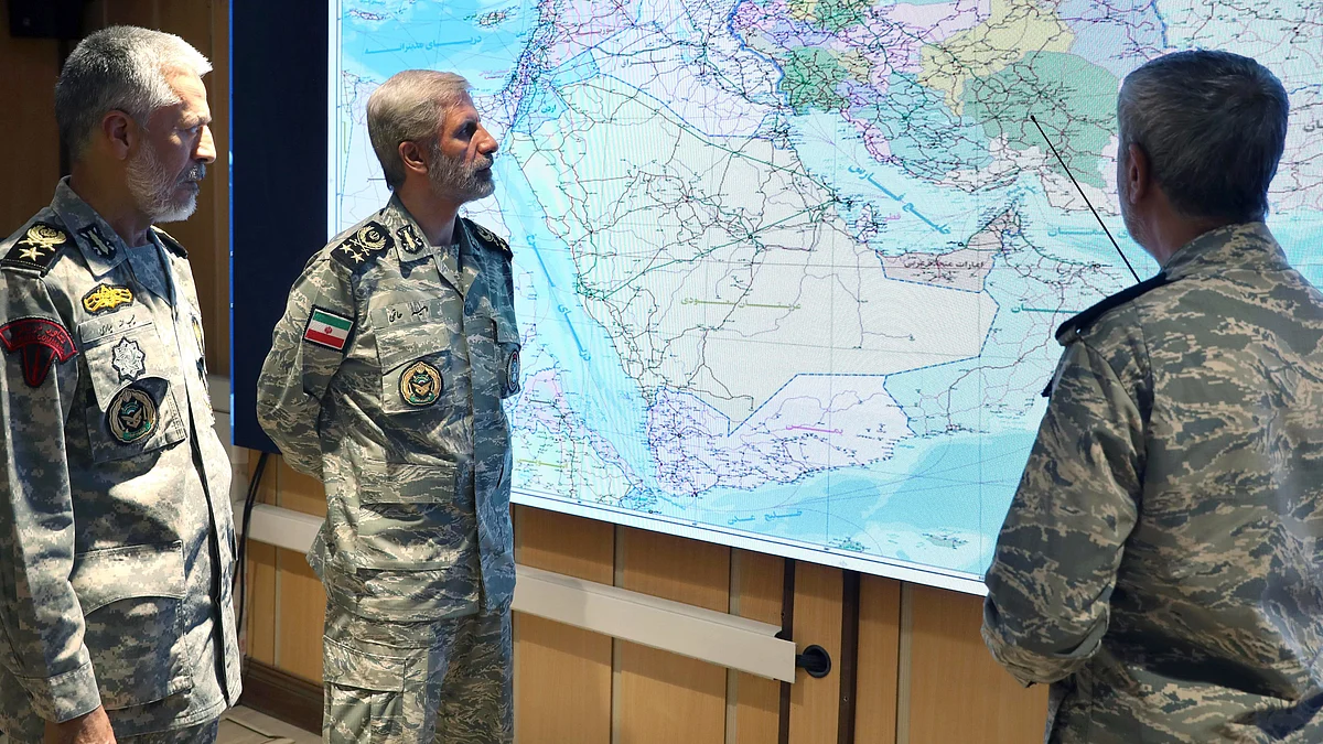 Iran's army commander-in-chief general Amir Hatami (C) attends a meeting on 23 June (photo: AP/PTI)