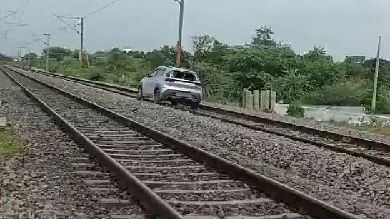 The car runs on railway track near Hyderabad on 26 June (photo: IANS)
