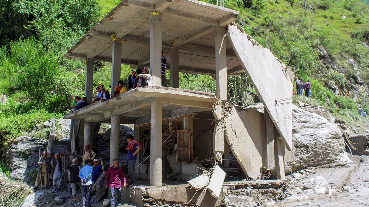 A damaged house in flash floods (photo: PTI)