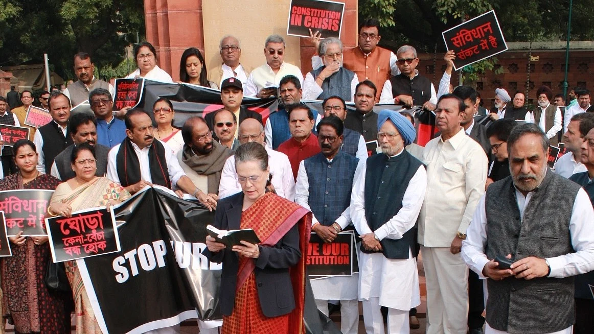 Sonia Gandhi reads the Preamble of Constitution in Parliament House premises. (NH archives)