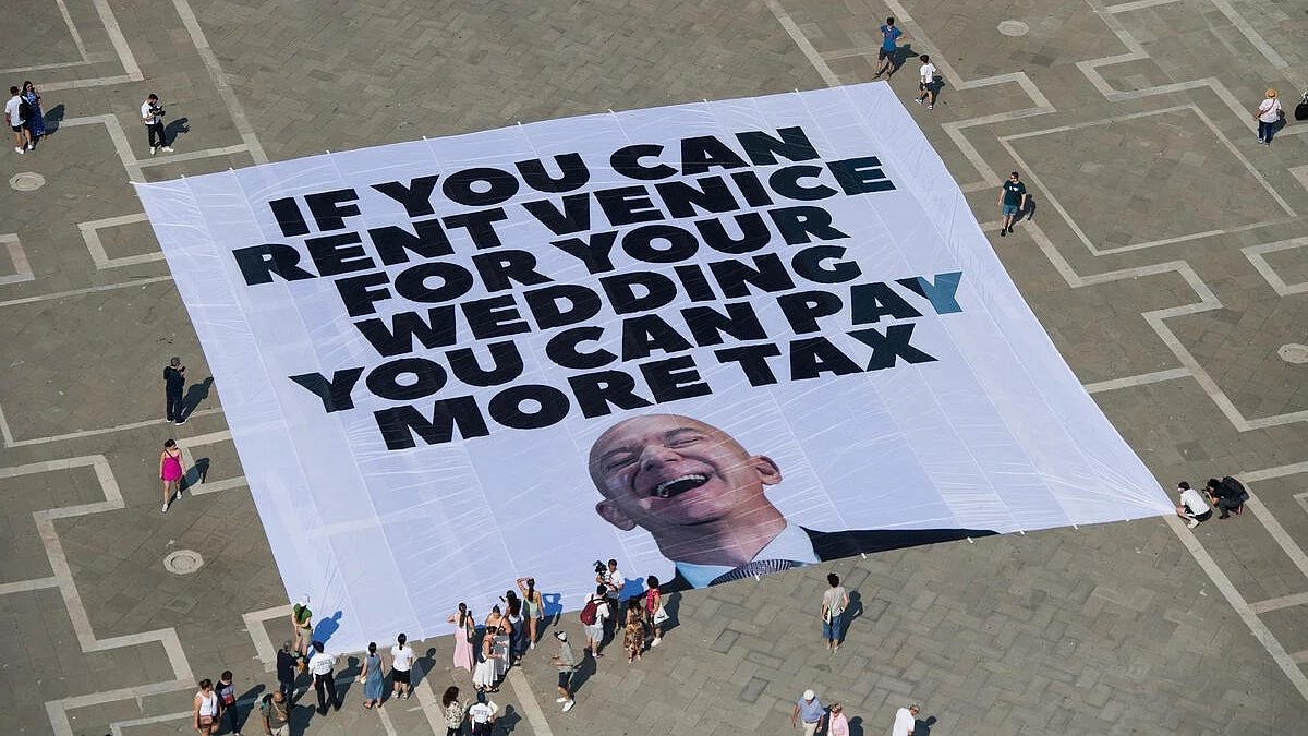 Protest against Jeff Bezos wedding plans in Venice with guests flying in by helicopter and private jet